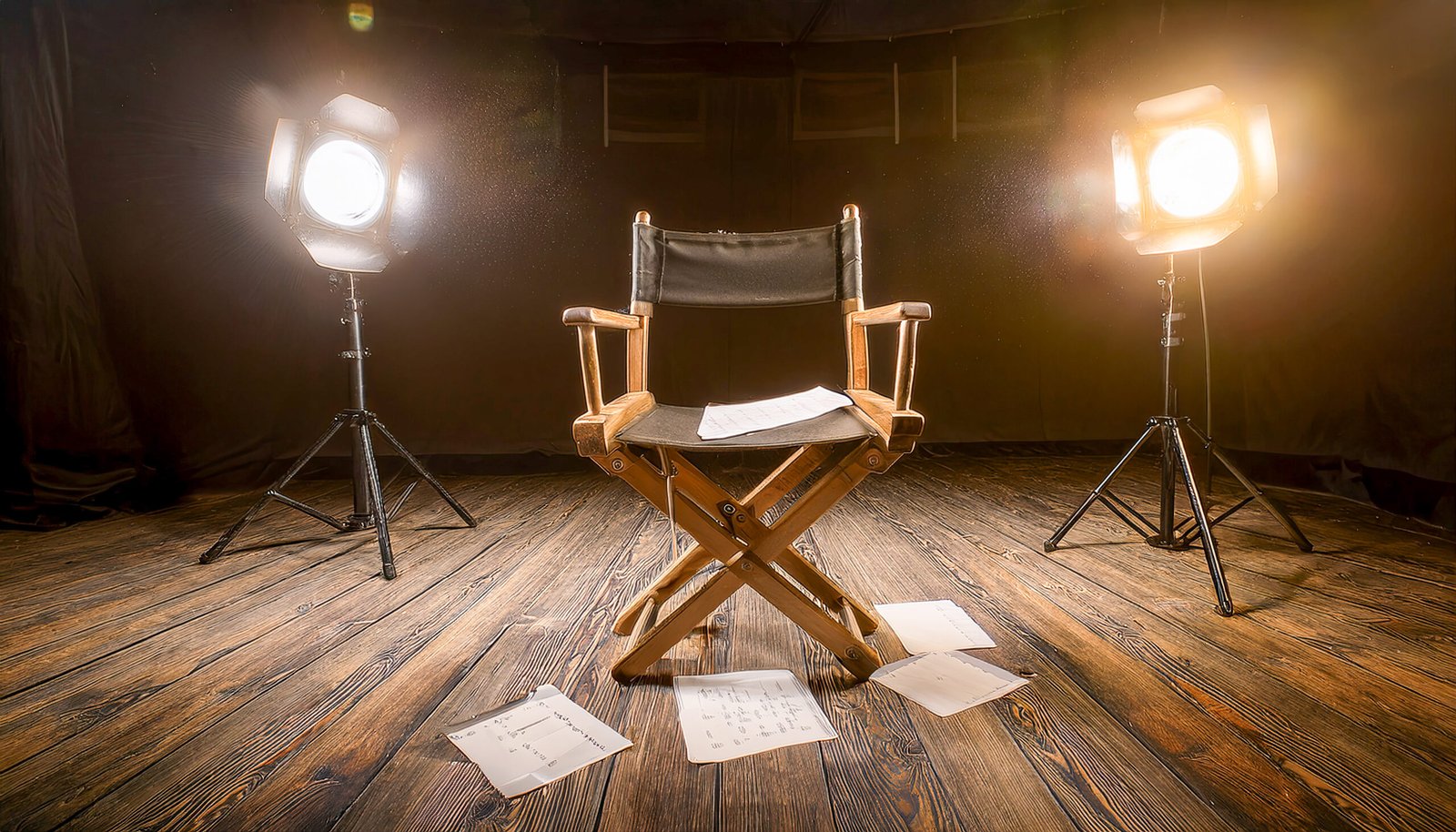 our-services-02 empty director's chair on a wooden floor, surrounded by scattere